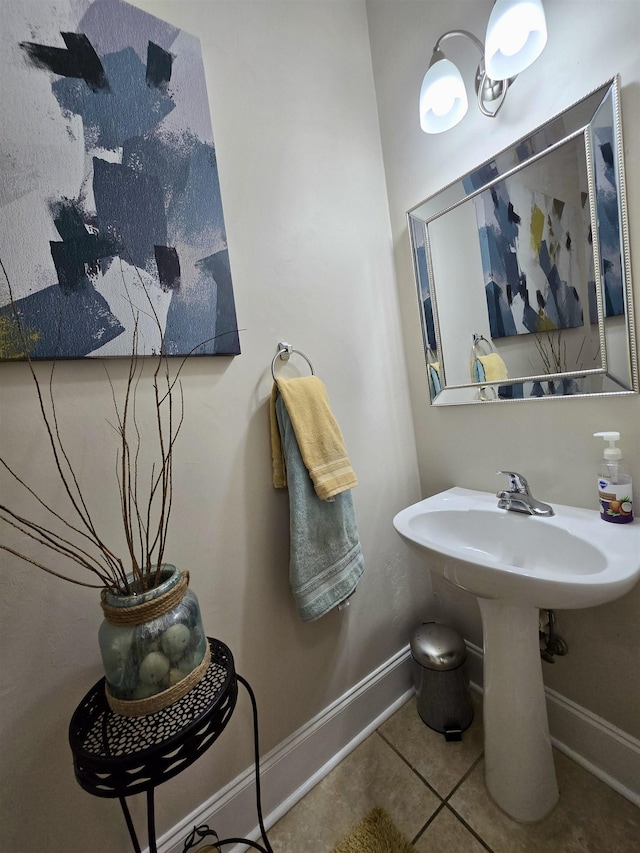 bathroom featuring baseboards and tile patterned flooring