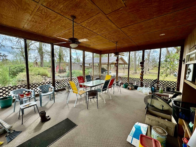 sunroom with ceiling fan and wood ceiling