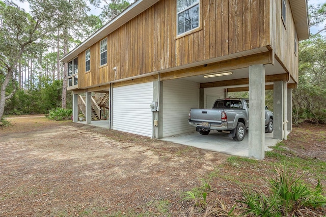 view of property exterior with a carport