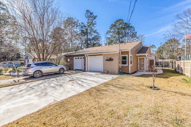 view of side of property with a garage and a lawn