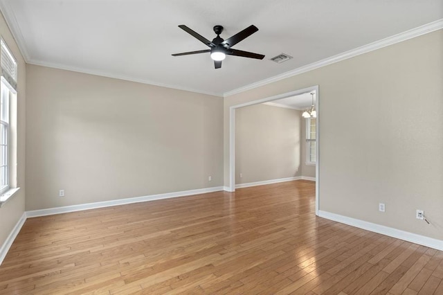 4075 Colleton Ct, Tallahassee, FL 32311 - empty room with plenty of natural light, light wood-style floors, ceiling fan, crown molding, and a chandelier
