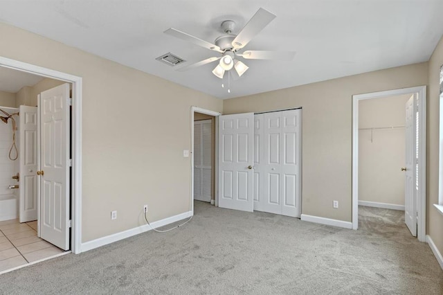 4075 Colleton Ct, Tallahassee, FL 32311 - unfurnished bedroom with carpet floors, multiple closets, ensuite bath, and ceiling fan