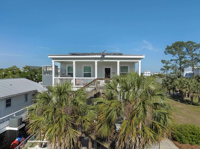 1548 Shell Point Rd, Crawfordville, FL 32327 - coastal home with a porch, central AC unit, and stairway