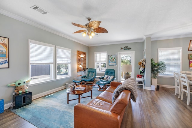 1548 Shell Point Rd, Crawfordville, FL 32327 - living room featuring wood finished floors, healthy amount of natural light, ornamental molding, a ceiling fan, and baseboards