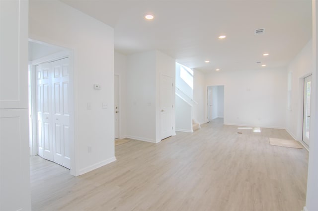 empty room with light hardwood / wood-style floors