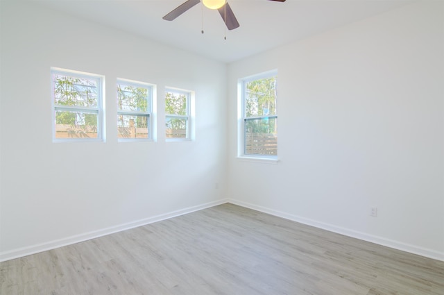 unfurnished room with ceiling fan and light hardwood / wood-style floors