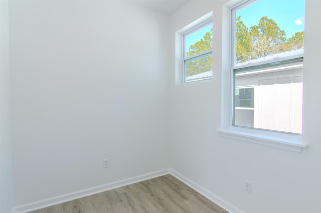 spare room featuring light wood-type flooring