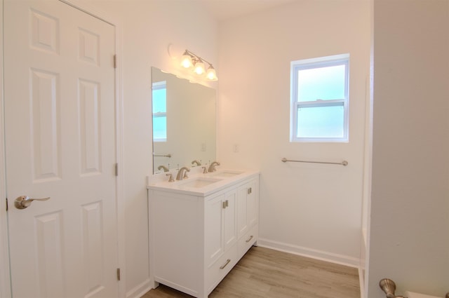 bathroom with vanity and hardwood / wood-style floors