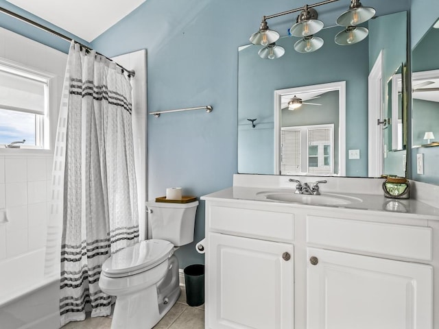 full bathroom featuring ceiling fan, toilet, tile patterned floors, shower / bath combination with curtain, and vanity