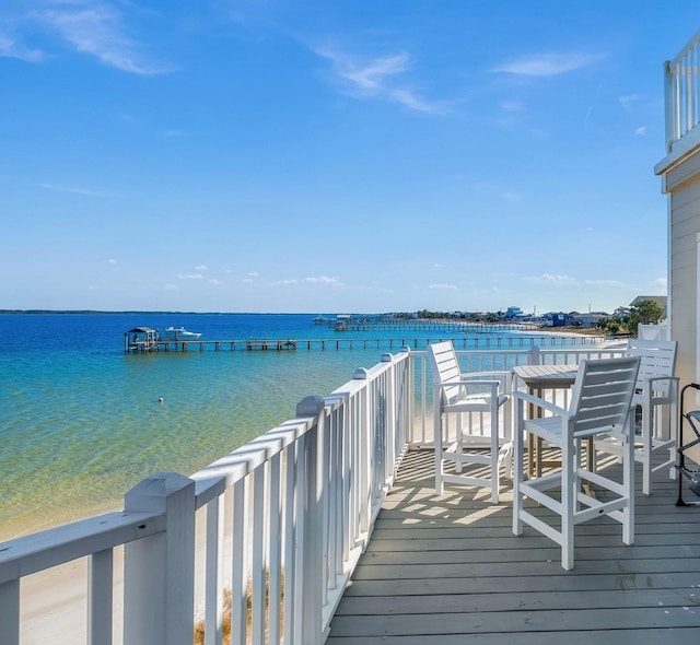 wooden deck featuring a water view