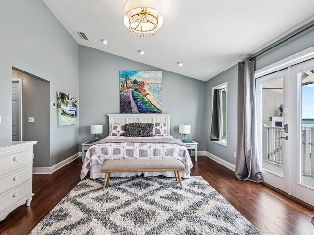 bedroom featuring dark wood-type flooring, french doors, access to outside, and lofted ceiling