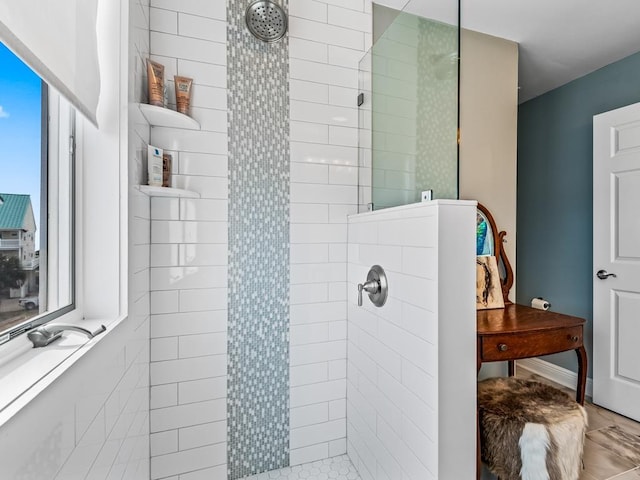 bathroom with tiled shower