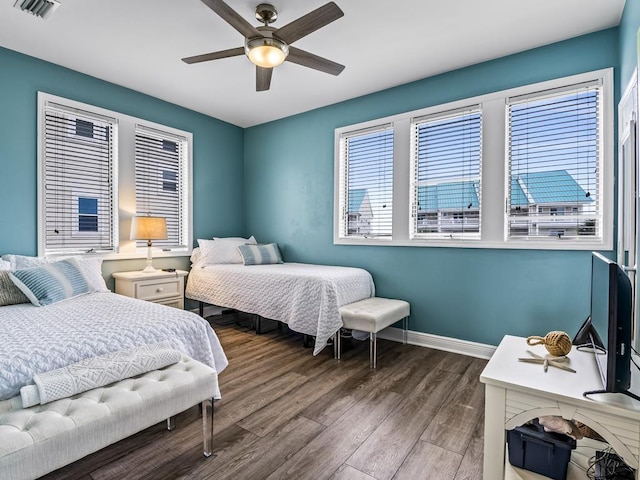 bedroom with ceiling fan and hardwood / wood-style flooring