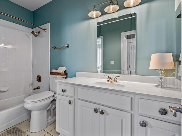 full bathroom featuring toilet, vanity, tile patterned floors, and tiled shower / bath combo