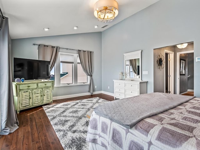 bedroom with lofted ceiling and dark hardwood / wood-style floors