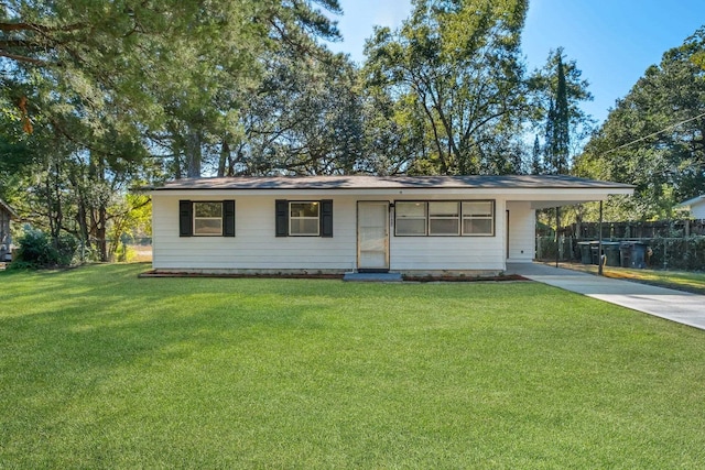 ranch-style house with a front yard and a carport