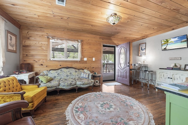 living room with dark hardwood / wood-style flooring, wooden walls, and wood ceiling