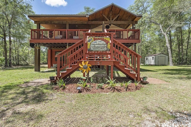 exterior space featuring a wooden deck, a storage unit, and a yard