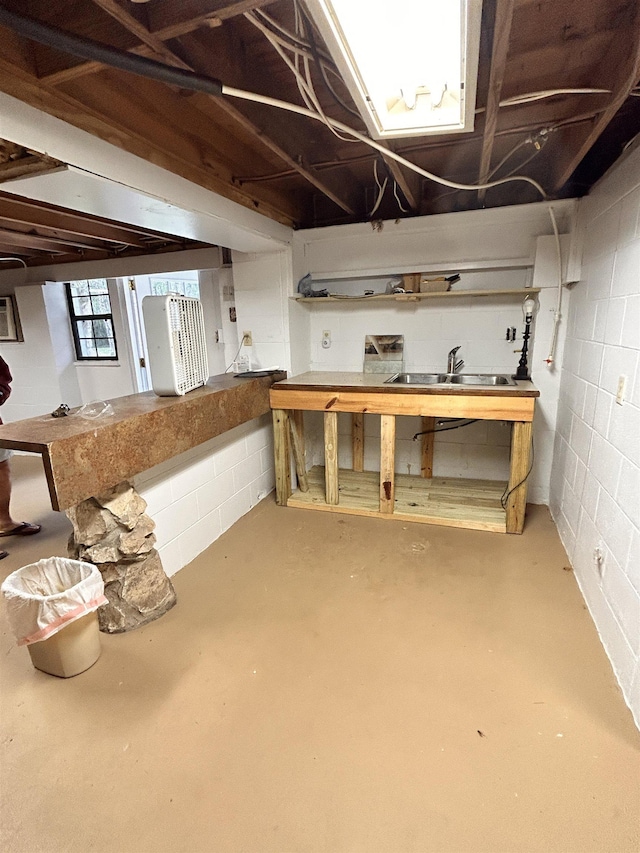 basement with sink and a workshop area