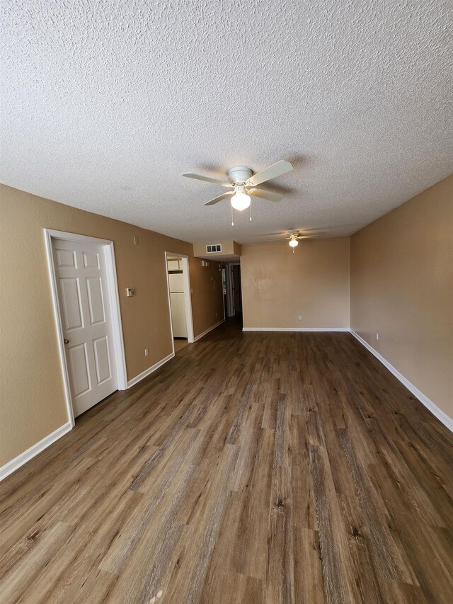 1100 Green Tree Ct Unit C, Tallahassee, FL 32304 - empty room featuring a ceiling fan, wood finished floors, a textured ceiling, and baseboards