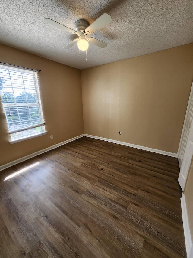 1100 Green Tree Ct Unit C, Tallahassee, FL 32304 - spare room with dark wood-style floors, ceiling fan, baseboards, and a textured ceiling
