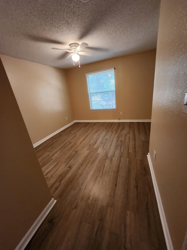 1100 Green Tree Ct Unit C, Tallahassee, FL 32304 - unfurnished room featuring wood finished floors, baseboards, a textured ceiling, and ceiling fan