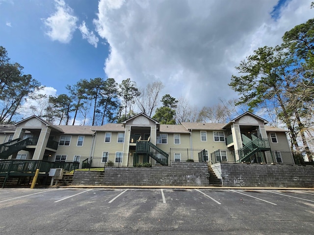 1100 Green Tree Ct Unit C, Tallahassee, FL 32304 - view of property with stairs and uncovered parking