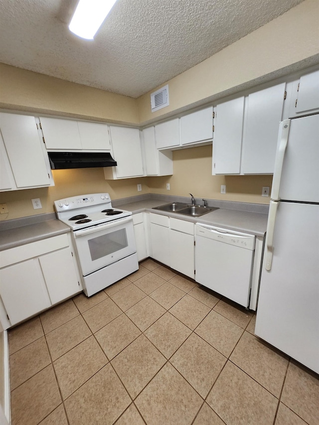 1100 Green Tree Ct Unit C, Tallahassee, FL 32304 - kitchen with white appliances, under cabinet range hood, a textured ceiling, a sink, and light tile patterned floors