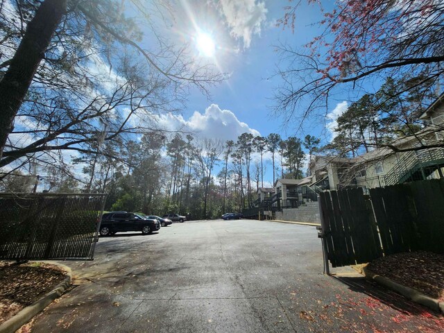 1100 Green Tree Ct Unit C, Tallahassee, FL 32304 - view of street with curbs and a gate