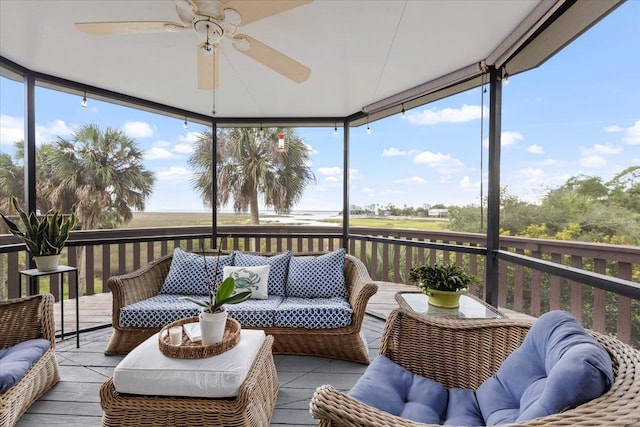 sunroom / solarium featuring ceiling fan