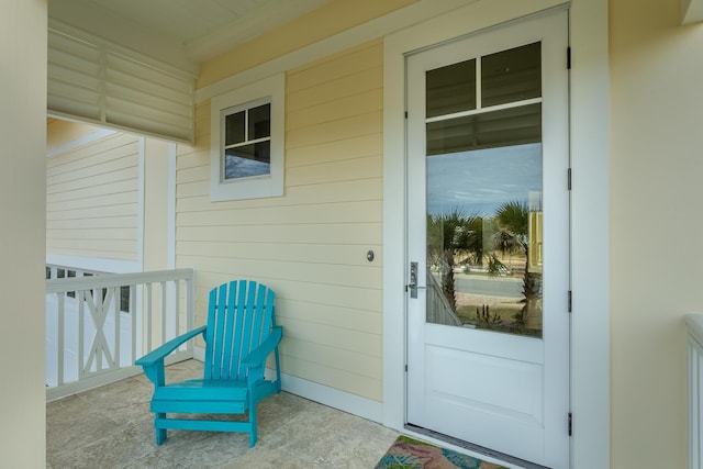 entrance to property featuring a porch