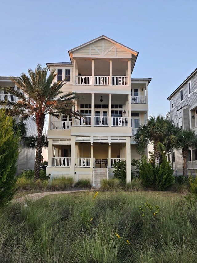 back of property featuring a balcony