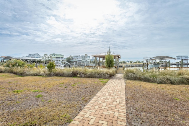 surrounding community featuring a gazebo and a dock