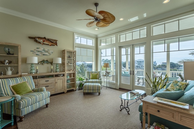 sunroom with ceiling fan and french doors