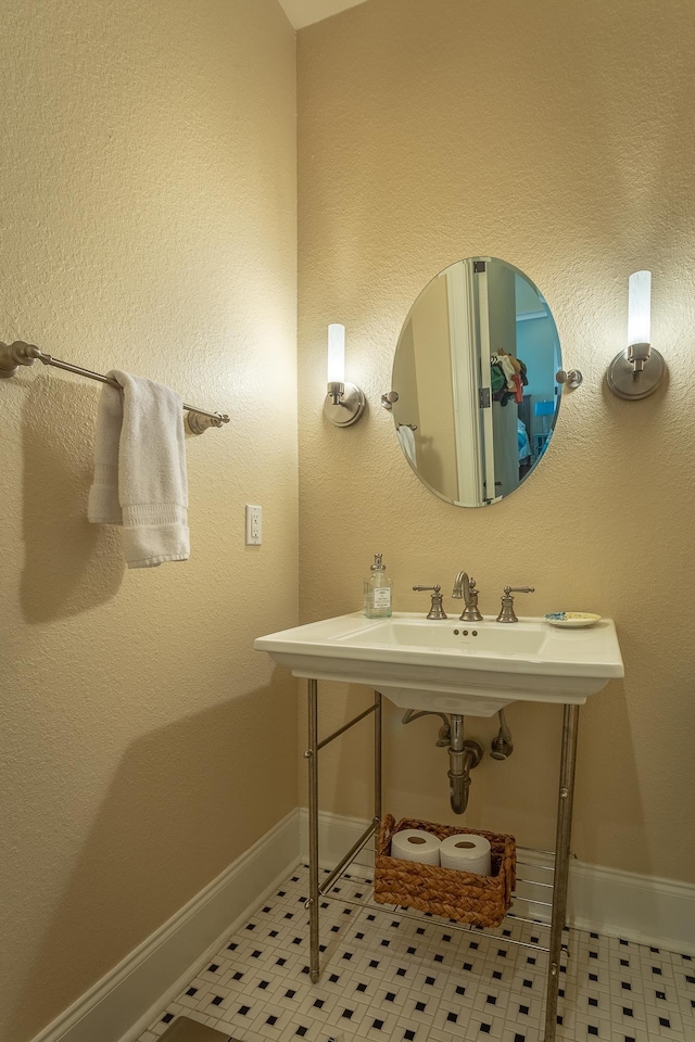 bathroom featuring tile patterned flooring and sink