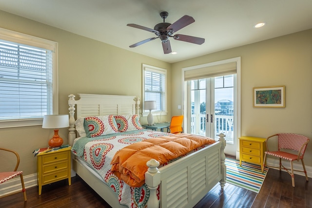 bedroom featuring dark wood-type flooring, access to outside, french doors, and ceiling fan