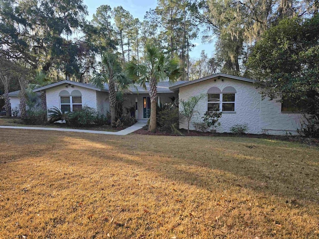 ranch-style house with a front yard