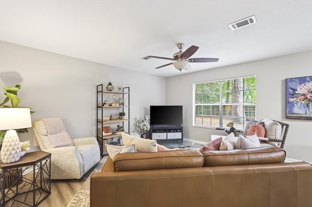 1816 Aaron Rd, Tallahassee, FL 32303 - living room with light wood finished floors and a ceiling fan