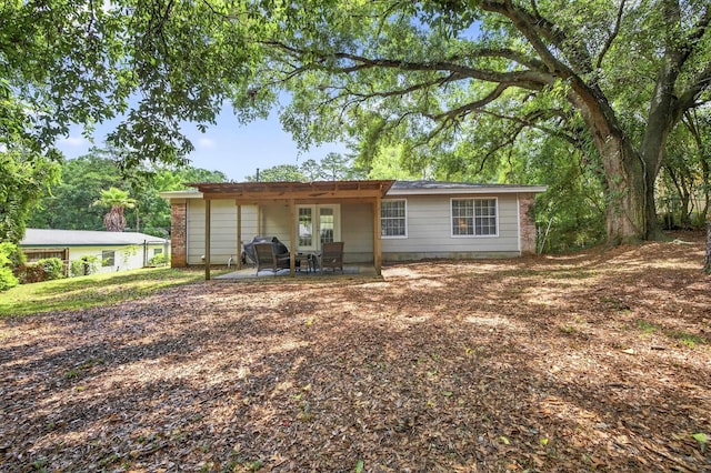 1816 Aaron Rd, Tallahassee, FL 32303 - rear view of property featuring a patio area and french doors