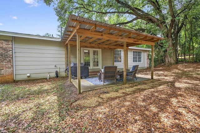 1816 Aaron Rd, Tallahassee, FL 32303 - rear view of property with a patio area, brick siding, and a pergola