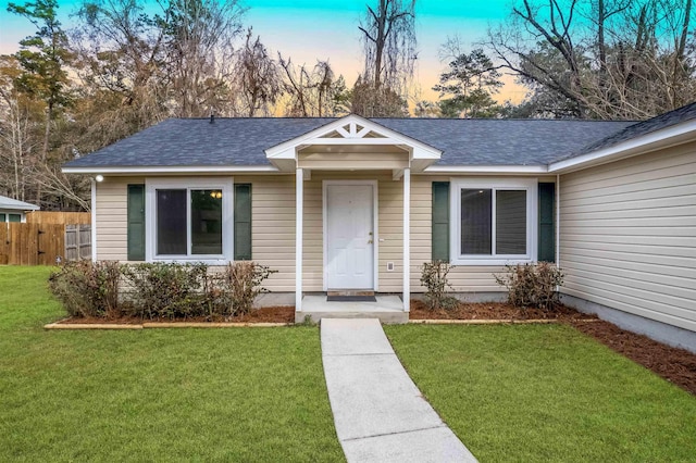 view of front of home with a yard