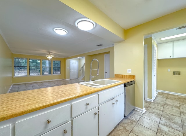 kitchen with white cabinetry, dishwasher, sink, ceiling fan, and ornamental molding