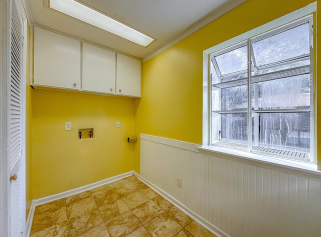 laundry area featuring hookup for a washing machine, cabinets, and ornamental molding