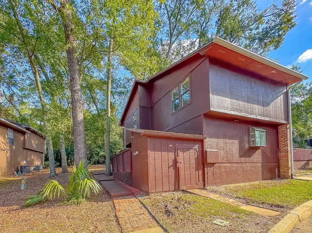 view of side of property with central AC unit