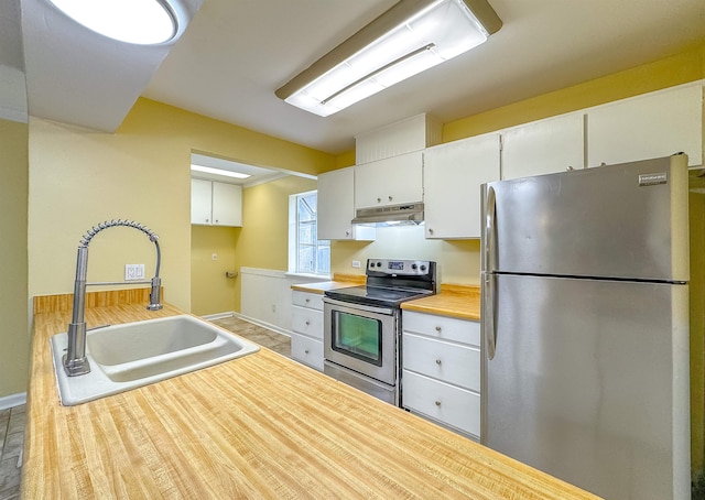 kitchen featuring white cabinetry, sink, and stainless steel appliances