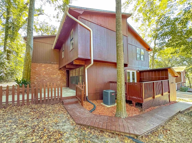 view of side of home featuring central air condition unit