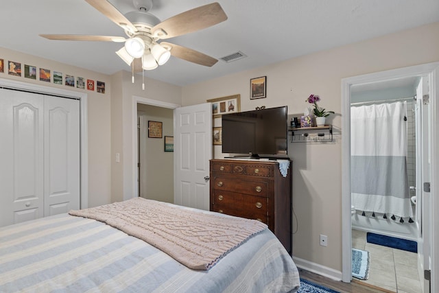 bedroom featuring a closet, ceiling fan, baseboards, and visible vents