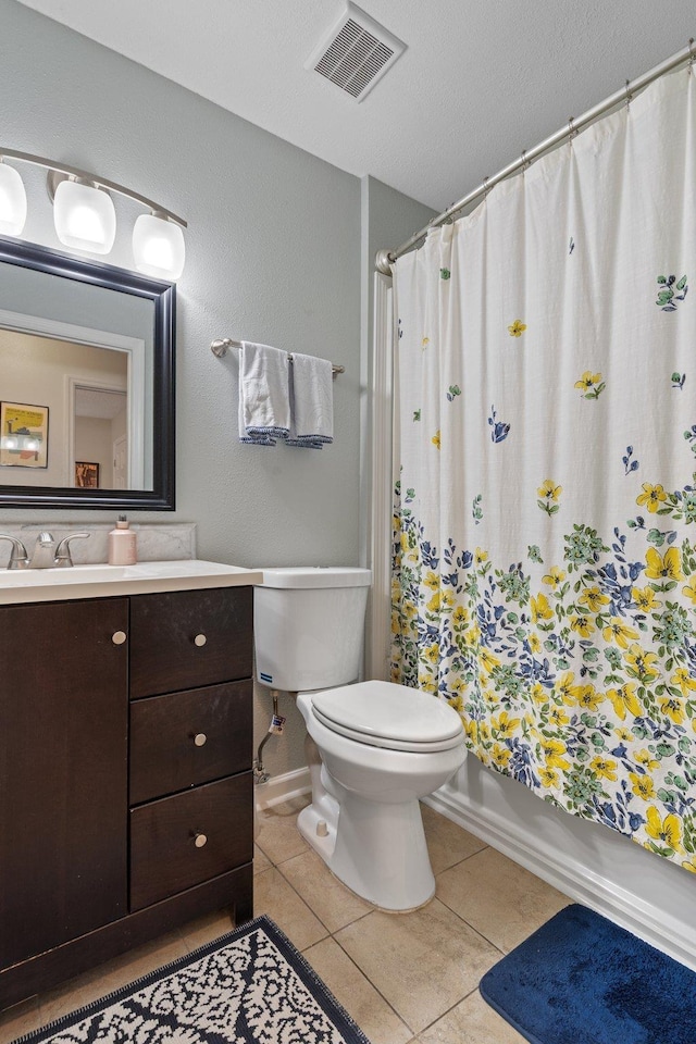 full bath with vanity, visible vents, toilet, shower / bath combo, and tile patterned floors