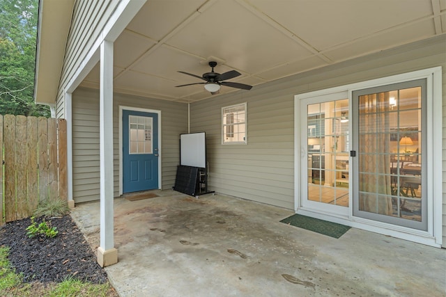view of patio / terrace featuring fence and a ceiling fan