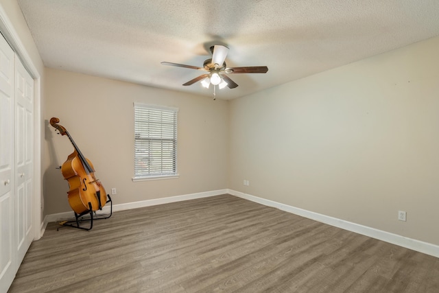 2214 Yaupon Dr, Tallahassee, FL 32303 - unfurnished room featuring wood finished floors, ceiling fan, and a textured ceiling